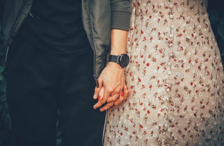 Young couple holding hands