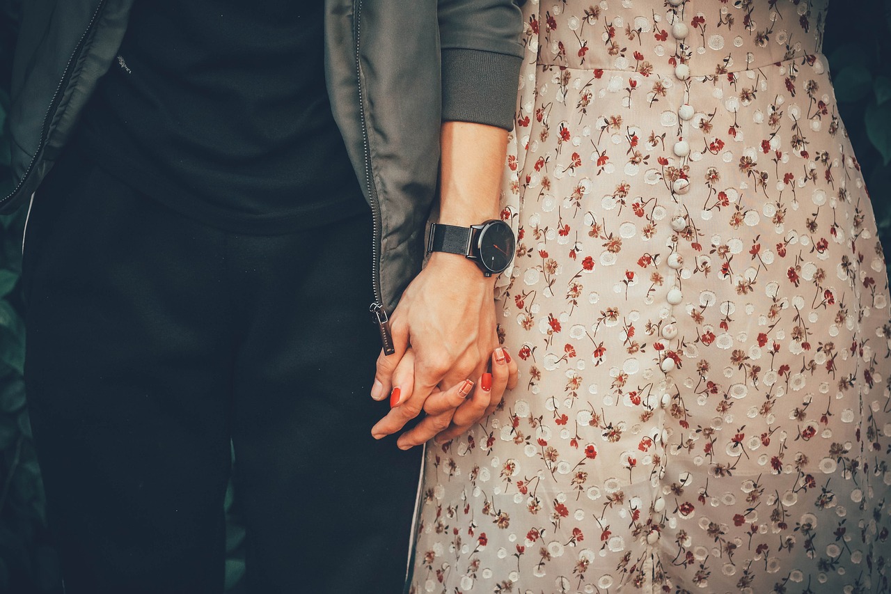 Young couple holding hands